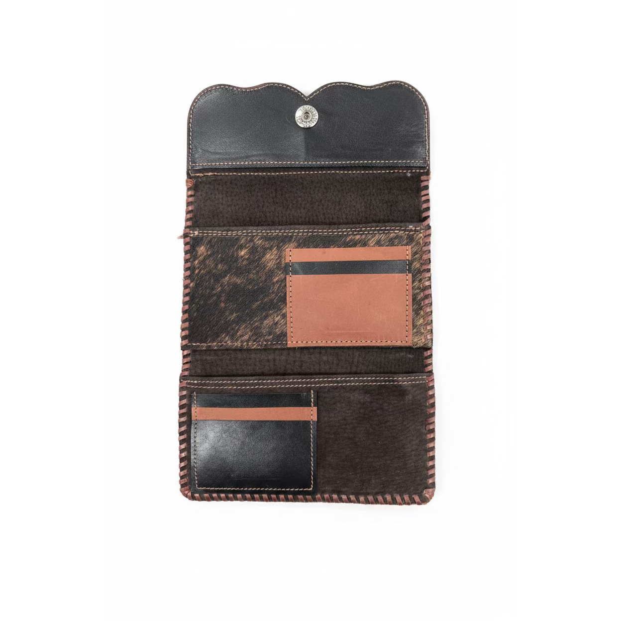 A western-style leather card holder wallet shown open, featuring a black leather top flap with a snap button, a textured brown and black cowhide patterned panel, a tan leather card slot, and a lower black leather card pocket with a tan accent strip.