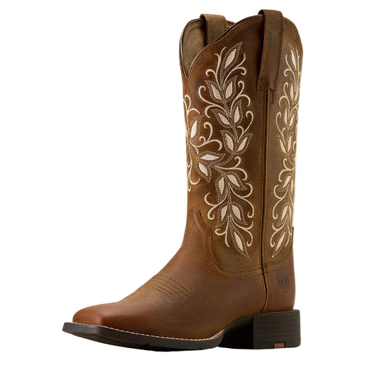Brown cowboy boot with intricate white embroidery on a white background