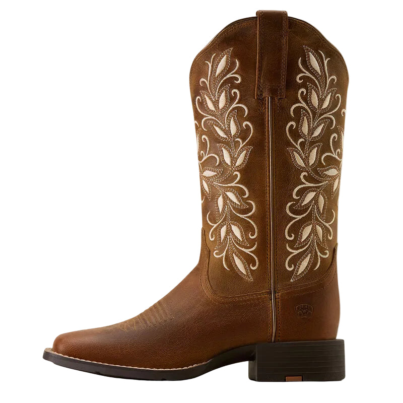 Brown cowboy boot with intricate white embroidery on a white background