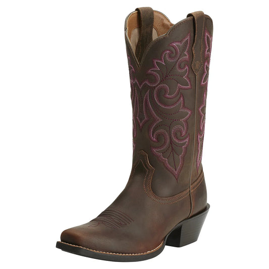 Brown cowboy boot with intricate pink embroidery on a white background